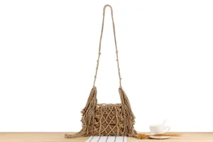 Handmade woven fringe shoulder bag detail, casual daily crossbody bag with long strap and tassel.
