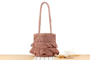 Detailed view of handmade woven shoulder bag with chic ruffles, perfect for casual daily use.