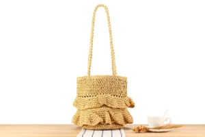 Detail view of the handmade straw woven shoulder bag with ruffles, perfect for casual daily use.