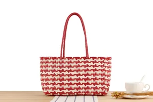 Red white woven tote bag detail, casual beach straw style shoulder market handbag close up