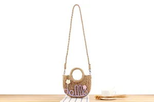 Handmade straw woven crossbody bag with cute floral letters for casual summer beach vacation.