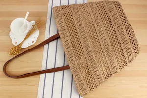 Woven straw shoulder bag with leather straps, casual large capacity beach tote for daily use.
