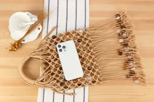 Woven macrame handbag with fringe and beads, stylish casual hollow tote bag for women daily use.