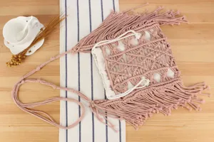 Handmade woven crossbody bag for women, stylish pink macrame shoulder bag with white inner pouch.