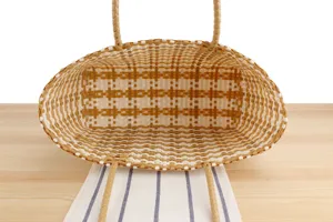 Detailed top view showing the interior texture and structure of the woven plastic tote beach bag.