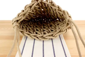 Handmade woven rope knot shoulder bag, perfect for beach vacation and daily casual fashion styling.