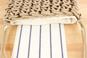 Handmade woven rope shoulder bag detail, stylish beach vacation women bag with lining.