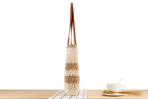 Handmade crochet shoulder bag detail, casual beige and brown striped woven texture design.