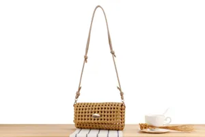 Detailed view of women hollow woven crossbody bag with adjustable strap and casual chic style.