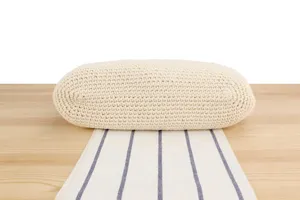 Handcrafted knit shoulder bag detail, casual woven texture, minimalist design style.