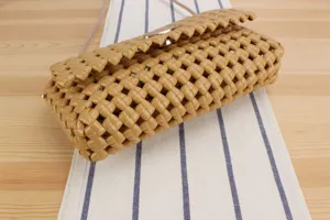 Stylish hollow woven crossbody bag for women, chic candy color casual shoulder handbag.