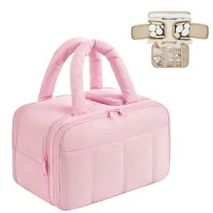 Large puffy travel cosmetic bag with multi-layer compartments and portable handles for daily use.