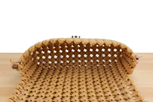Detailed close-up view of camel woven hollow shoulder bag interior showing exquisite craftsmanship.