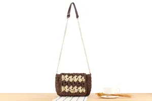 Handmade straw woven shoulder bag for women, chic crossbody purse with chain strap.