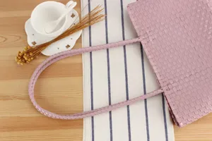 Pink woven plastic tote bag, handmade casual beach picnic basket, minimalist chic handbag.
