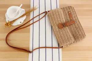 Casual straw shoulder bag for women, retro woven purse with leather strap for beach.
