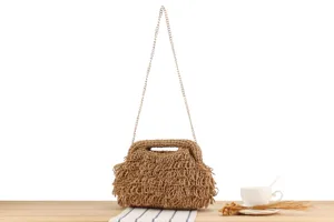 Handmade woven straw shoulder bag detail, perfect for beach vacation and casual daily style.