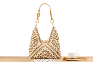 Handcrafted cotton rope woven shoulder bag detail, featuring chic wooden bead handle and pattern.