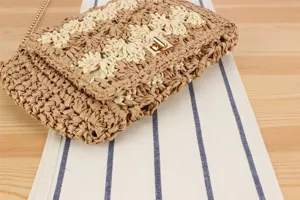 Handmade straw woven cross-body bag with clover pattern, detailed view for women summer.