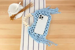 Blue woven hollowing out bag with wooden bead handle and tassel for daily casual and beach vacation.