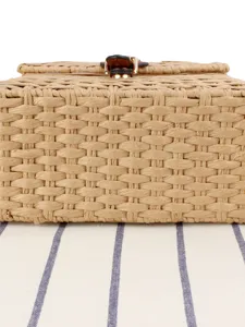 Handwoven straw basket bag with leather closure, stylish structured handbag for casual daily use.