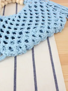 Blue woven macrame handbag with wooden bead handle, casual fringe beach bag for women.