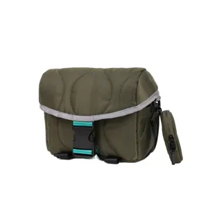 Olive green quilted camera bag with crossbody strap, compact portable mini messenger bag.