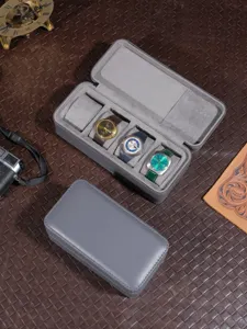 Draagbare reisuurwerk opbergdoos met meerdere vakken, premium grijs leer en zachte fluweel.