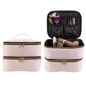 Double layer pink quilted makeup bag and nail polish storage organizer with dual zippers.