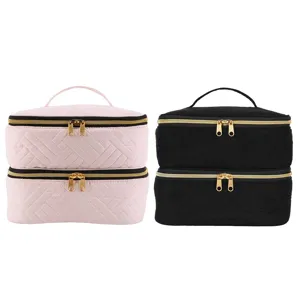 Double layer velvet cosmetic bag with quilted design and gold zippers for portable storage.
