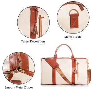 PU leather travel duffel bag with stylish brown trim, tassel detail, and smooth metal zippers.