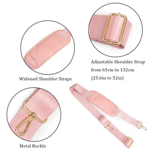 Close-up of pink adjustable bag strap with metal buckle and widened shoulder pad details.