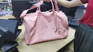 Large capacity pink PU leather travel duffel bag with shoulder strap and dual handles for women