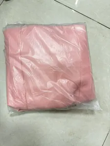 Pink PU leather garment bag, fold-able clothing storage organizer for travel and business suits.