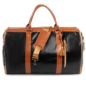 Close-up details of black and brown PU leather travel duffel bag with durable handle and straps.