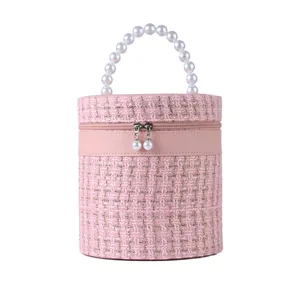 Roze tweed cosmetische tas met parelhandvat, grote ronde make-up opbergdoos voor op reis.