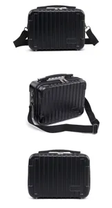Black hardshell mini suitcase shoulder bag with vertical ribs, durable travel case.