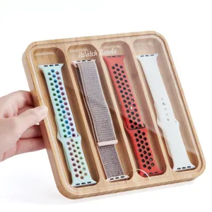 Boîte de rangement en bois pour bracelets de montre avec 4 fentes et couvercle transparent.