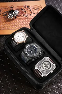 Premium black leather watch storage box with multi slots, portable travel watch case for men.