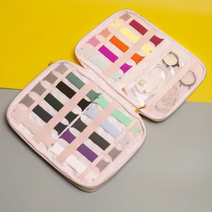 Pink electronics organizer bag with multi slots for silicone watch bands and charging cables