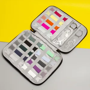 Detailed interior view of electronics organizer bag filled with colorful watch bands and cable.
