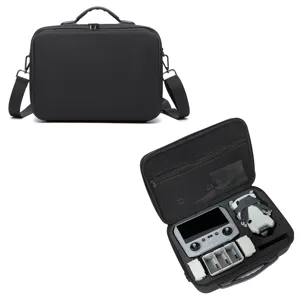Durable black carrying case for drone, portable shoulder bag with custom foam interior storage.