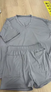Detail view of the casual V-neck short sleeve top and shorts set in solid gray color.