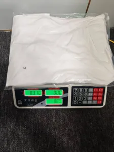 Detail view of the packaged solid color loose pajama set, showing packaging and product weight.