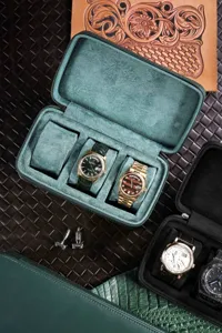 Portable green leather travel watch storage box featuring soft suede interior multi slots.