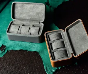 Detailed view of the 3-slot portable watch travel case interior with soft grey velvet pillows.