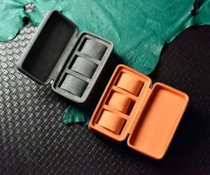 Detail view of portable 3-slot travel watch storage box with soft velvet interior and zipper.