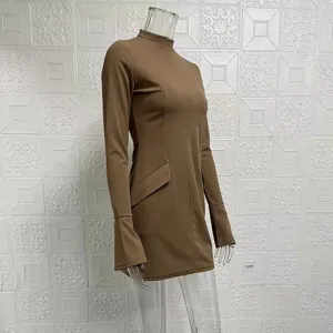 Detail view of brown long sleeve mock neck bodycon mini dress showing flared cuffs and fit.