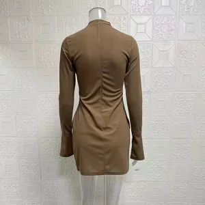 Detail view showing the back design of the stylish slim-fit long-sleeved brown bodycon dress.
