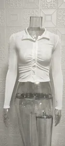 White ribbed long sleeve crop top shirt detail showing front ruching and lapel collar design.